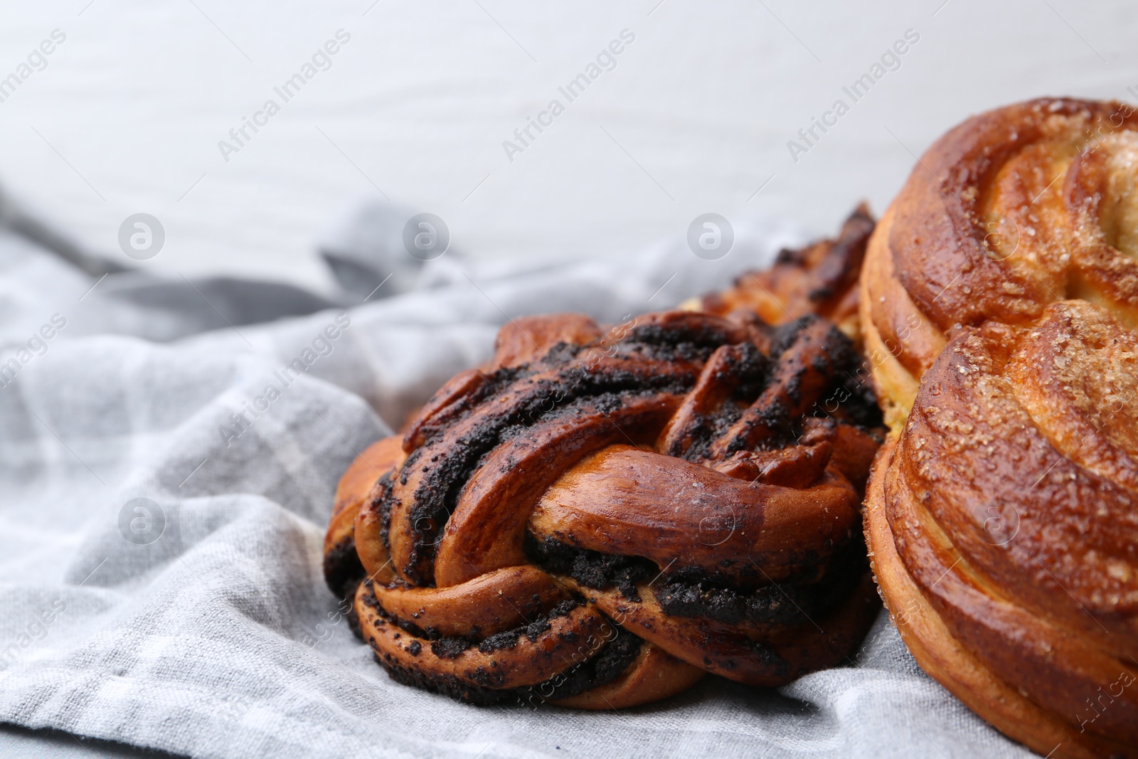 Photo of Different delicious pastries on grey table, closeup