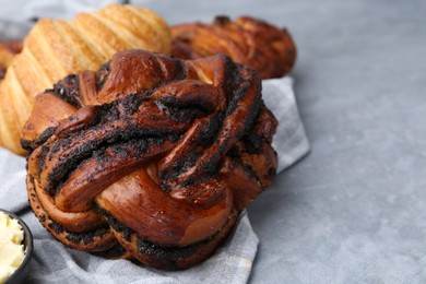 Photo of Different delicious pastries on grey table, closeup. Space for text