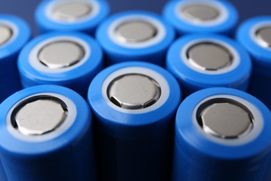 Photo of Many AA cell batteries as background, closeup