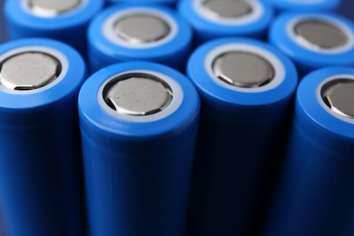 Photo of Many AA cell batteries as background, closeup