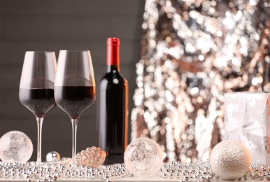 Photo of Red wine and beautiful Christmas decor on white table