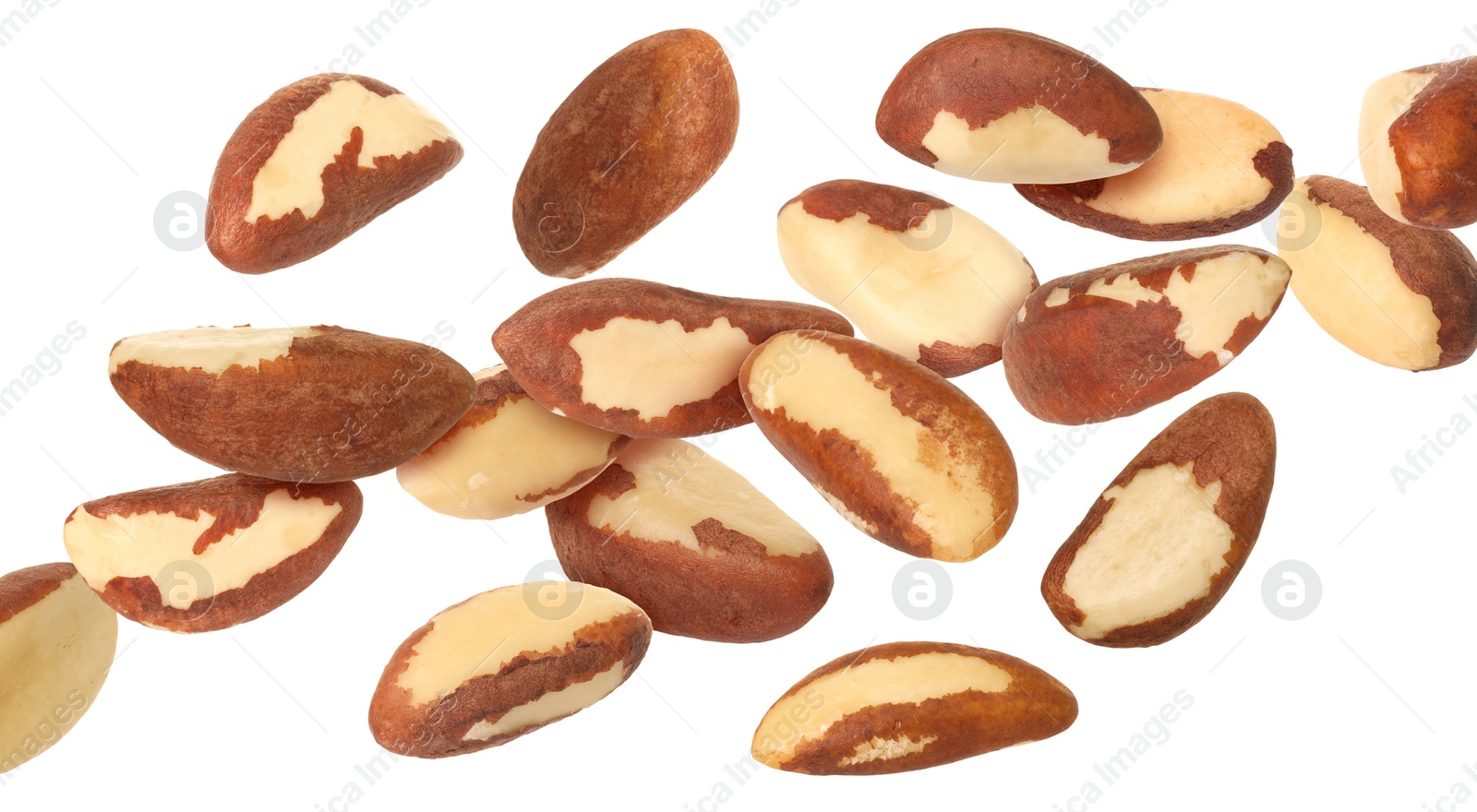 Image of Many Brazil nuts in air on white background