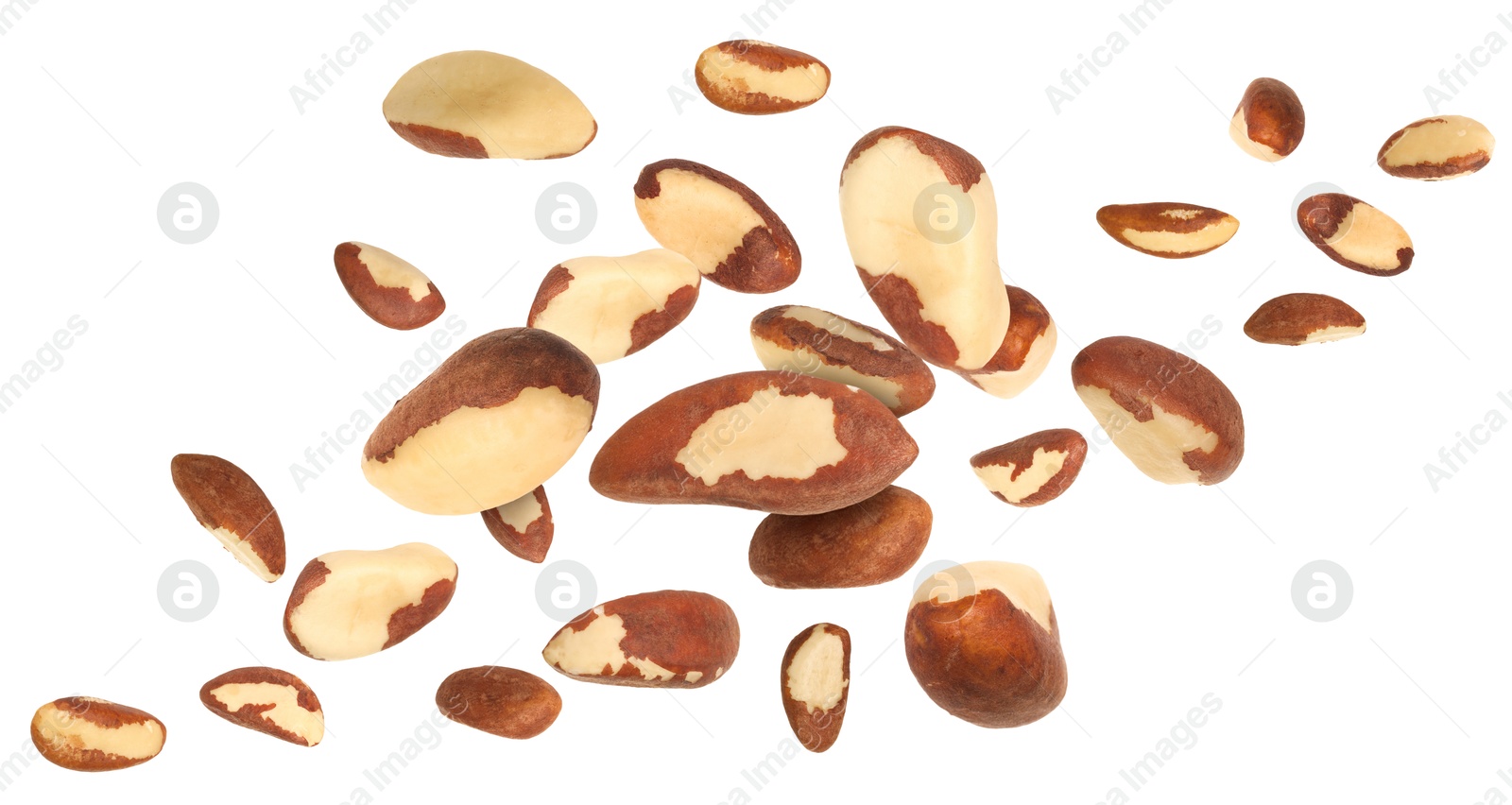 Image of Many Brazil nuts in air on white background