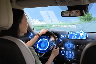 Image of Woman driving her car. Autopilot system and other digital elements in modern vehicle. Futuristic concept