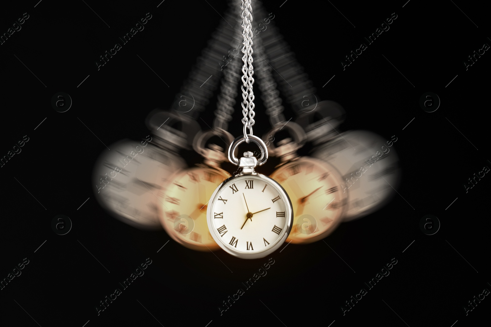 Image of Hypnosis session. Vintage pocket watch swinging on black background, motion blur effect