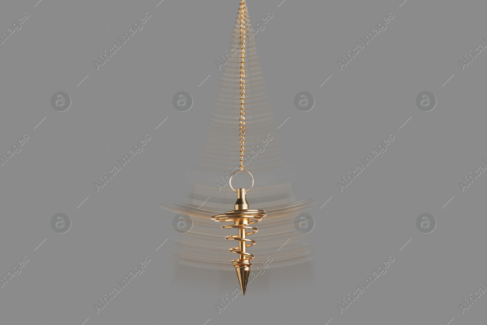 Image of Hypnosis session. Golden pendulum swinging on grey background, motion blur effect