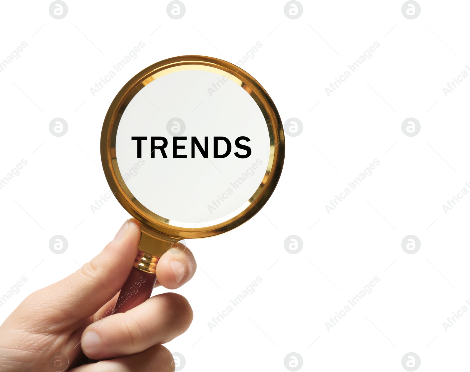 Image of Woman looking at word Trends through magnifying glass on white background, closeup. Concept of searching for new and popular ideas