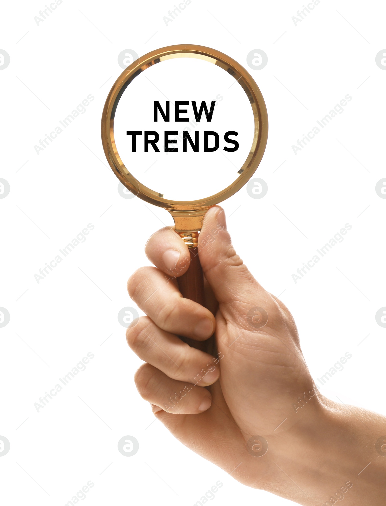 Image of Woman looking at words New Trends through magnifying glass on white background, closeup. Concept of searching for fresh and popular ideas