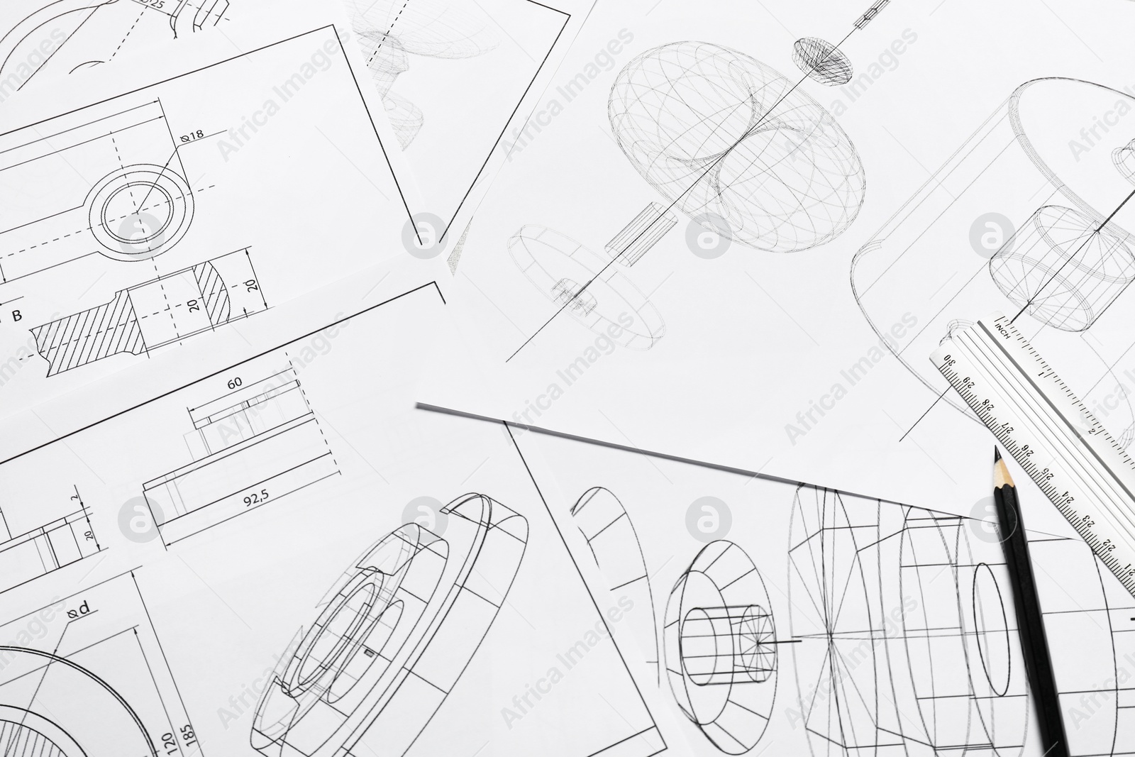 Photo of Different engineering drawings, ruler and pencil, above view