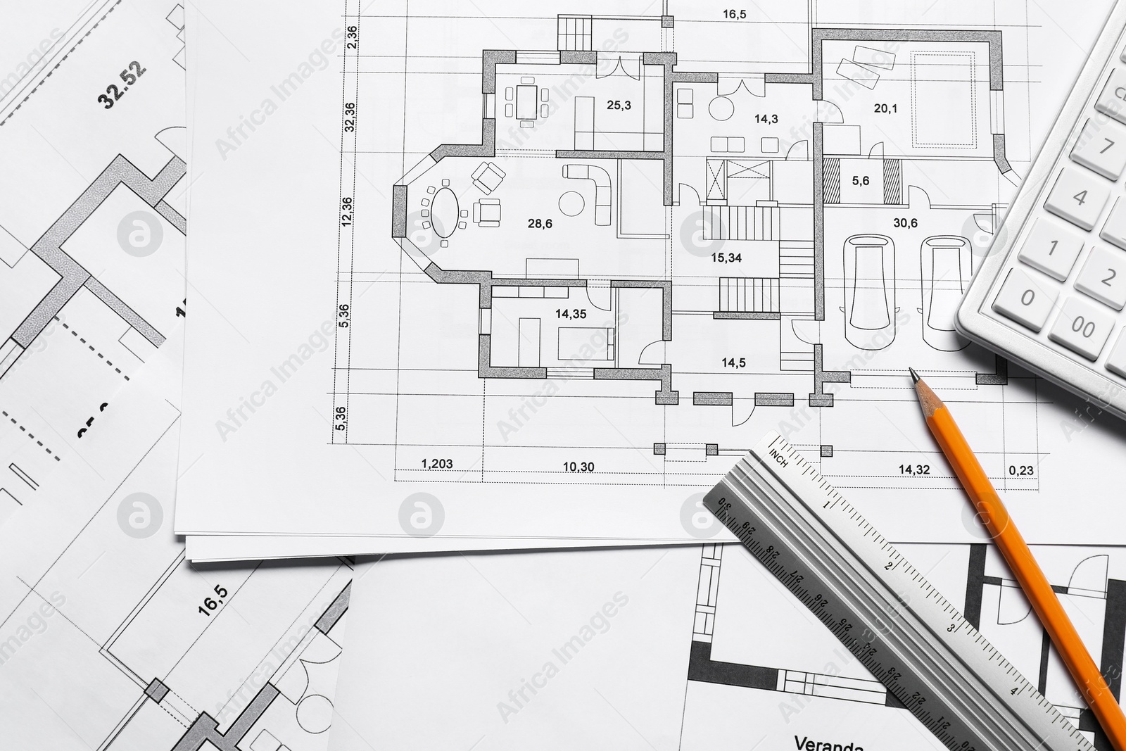 Photo of Different architectural drawings, calculator, ruler and pencil, top view