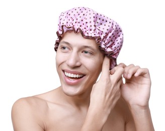 Photo of Happy man wearing pink shower cap on white background