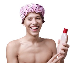 Photo of Happy man with pink shower cap and shampoo on white background