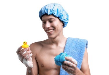 Photo of Happy man with shower cap, towel, bath duck and mesh sponge on white background