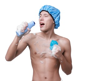 Photo of Man with shower cap, mesh sponge and shampoo singing on white background