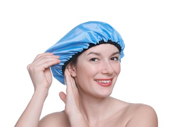 Woman wearing blue shower cap on white background