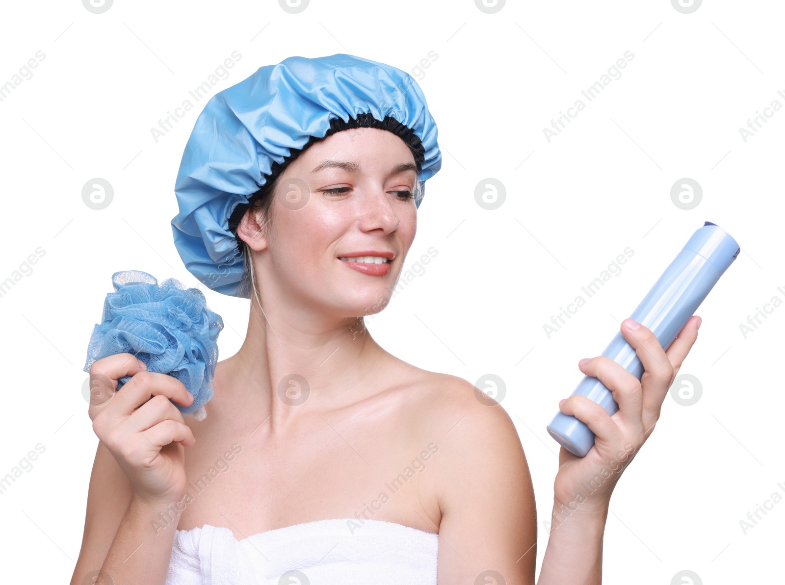 Photo of Woman with blue shower cap, mesh sponge and shampoo on white background