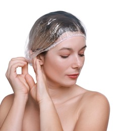 Woman wearing shower cap on white background