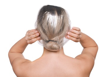 Woman wearing shower cap on white background, back view