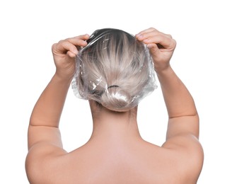 Photo of Woman wearing shower cap on white background, back view