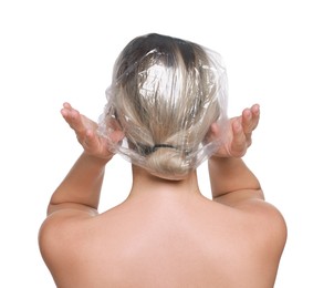 Woman wearing shower cap on white background, back view