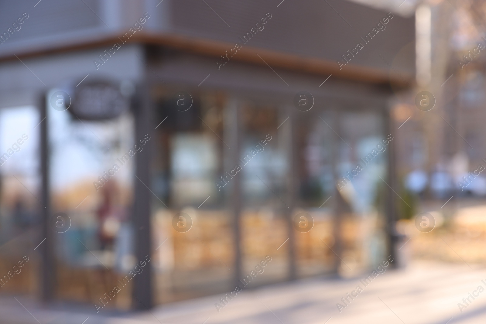 Photo of Stylish restaurant on city street, blurred view