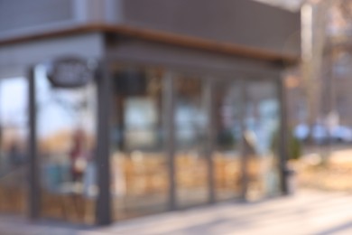 Photo of Stylish restaurant on city street, blurred view