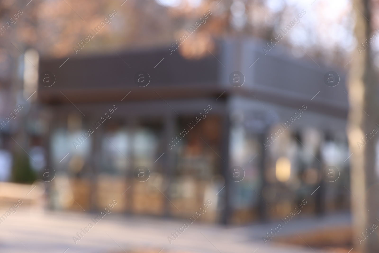 Photo of Stylish restaurant on city street, blurred view