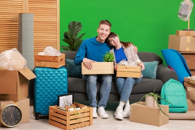 Happy couple with different stuff in new apartment. Housewarming party