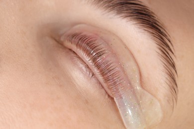 Photo of Woman undergoing procedure of eyelash lamination, closeup