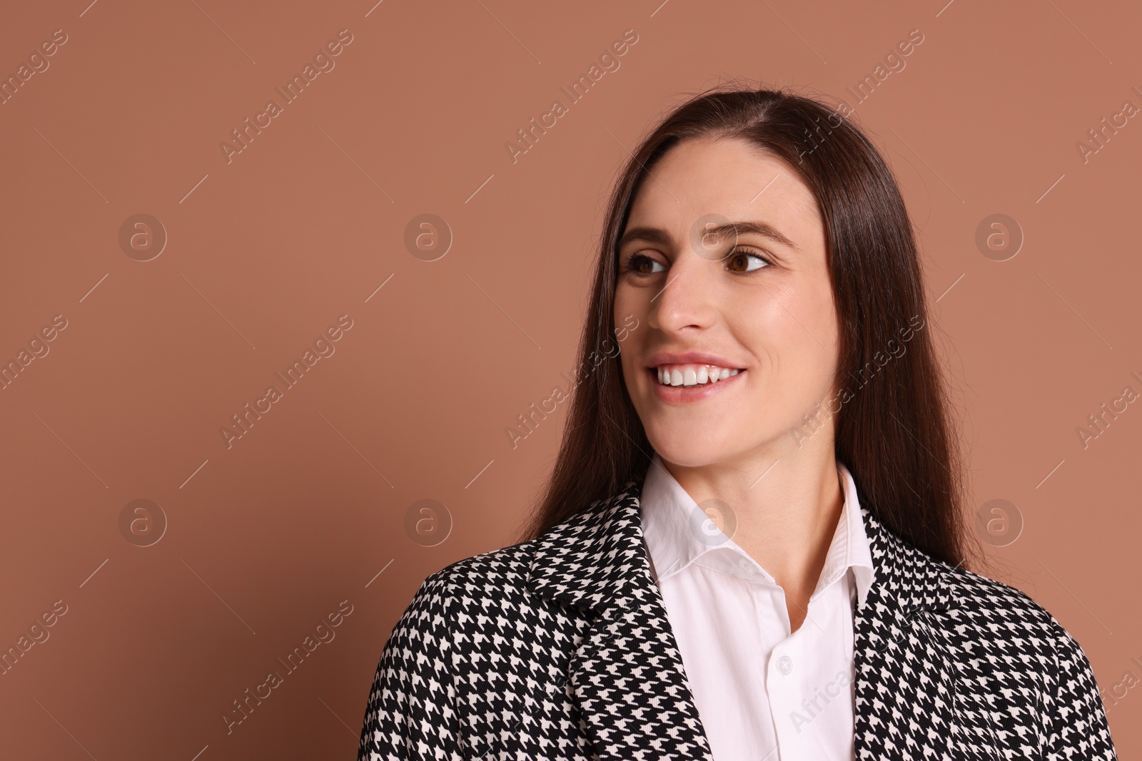 Photo of Portrait of banker in jacket on brown background, space for text