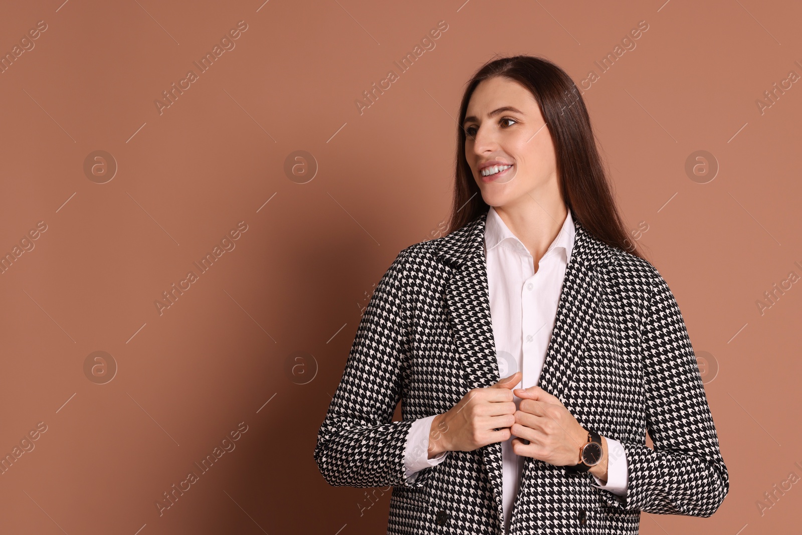 Photo of Portrait of banker in jacket on brown background, space for text