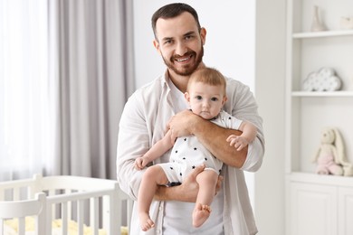 Photo of Dad with his cute little baby at home