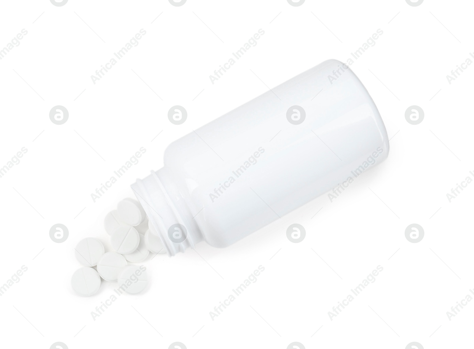 Photo of Medical bottle with antibiotic pills isolated on white, top view