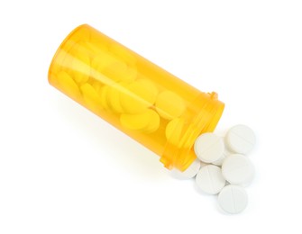 Photo of Medical bottle with antibiotic pills isolated on white, top view