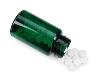 Photo of Medical bottle with antibiotic pills isolated on white, top view