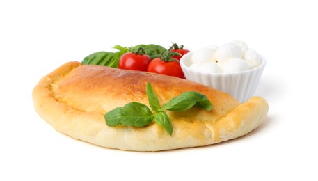 Photo of Tasty vegetarian calzone with basil, mozzarella cheese and tomatoes isolated on white