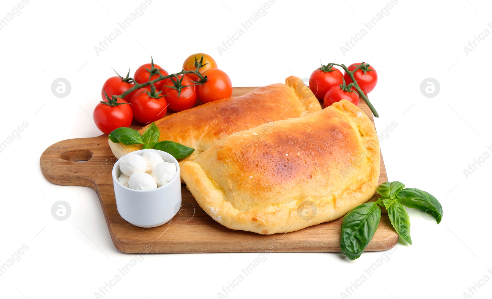 Photo of Tasty vegetarian calzones with basil, mozzarella cheese and tomatoes isolated on white