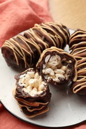 Delicious chocolate puffed rice bars on table, closeup