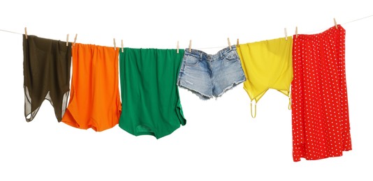 Photo of Different clothes drying on laundry line against white background