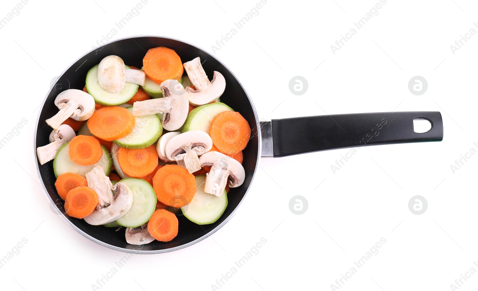 Photo of Frying pan with fresh vegetables and mushrooms isolated on white, top view