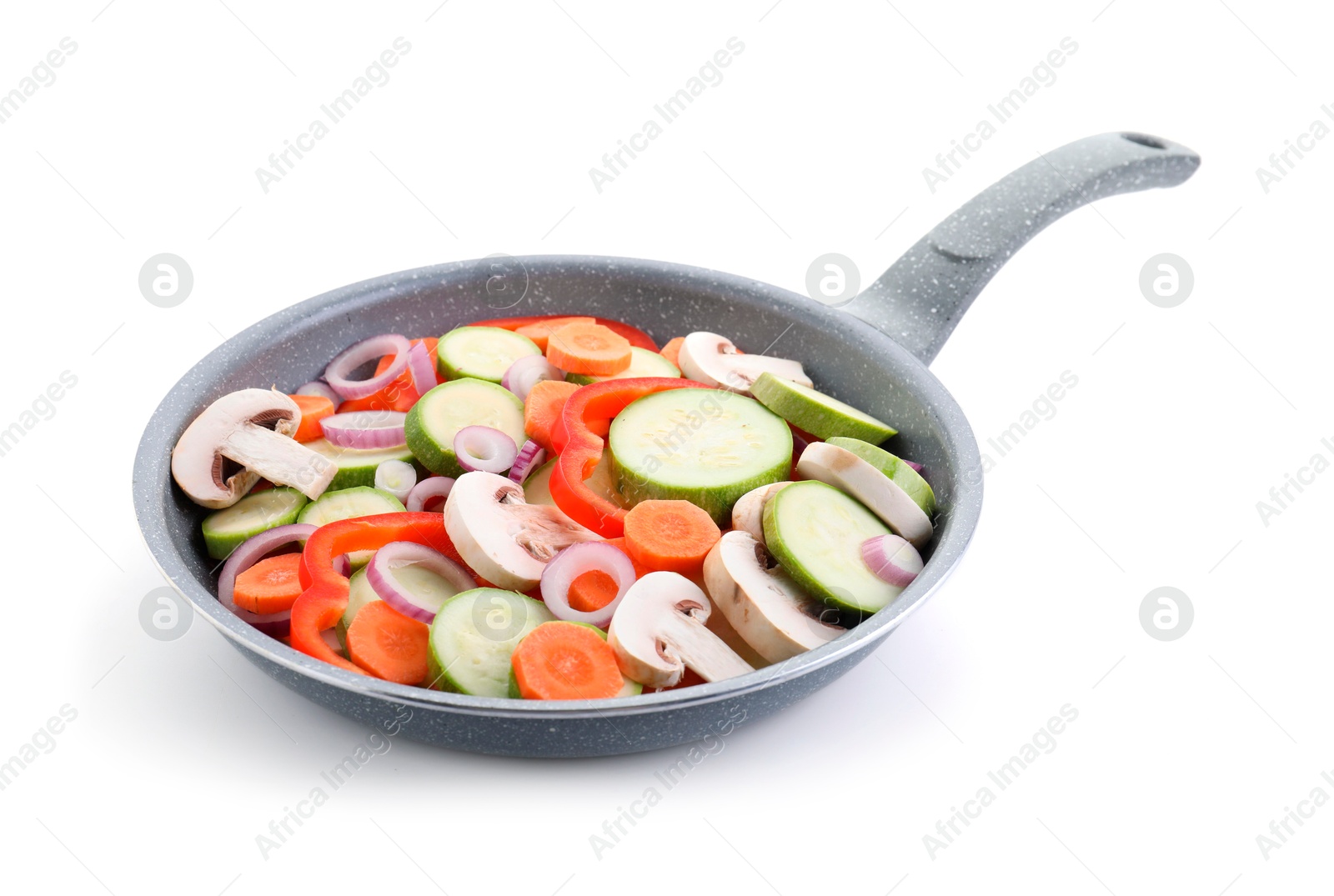 Photo of Frying pan with mix of fresh vegetables and mushrooms isolated on white