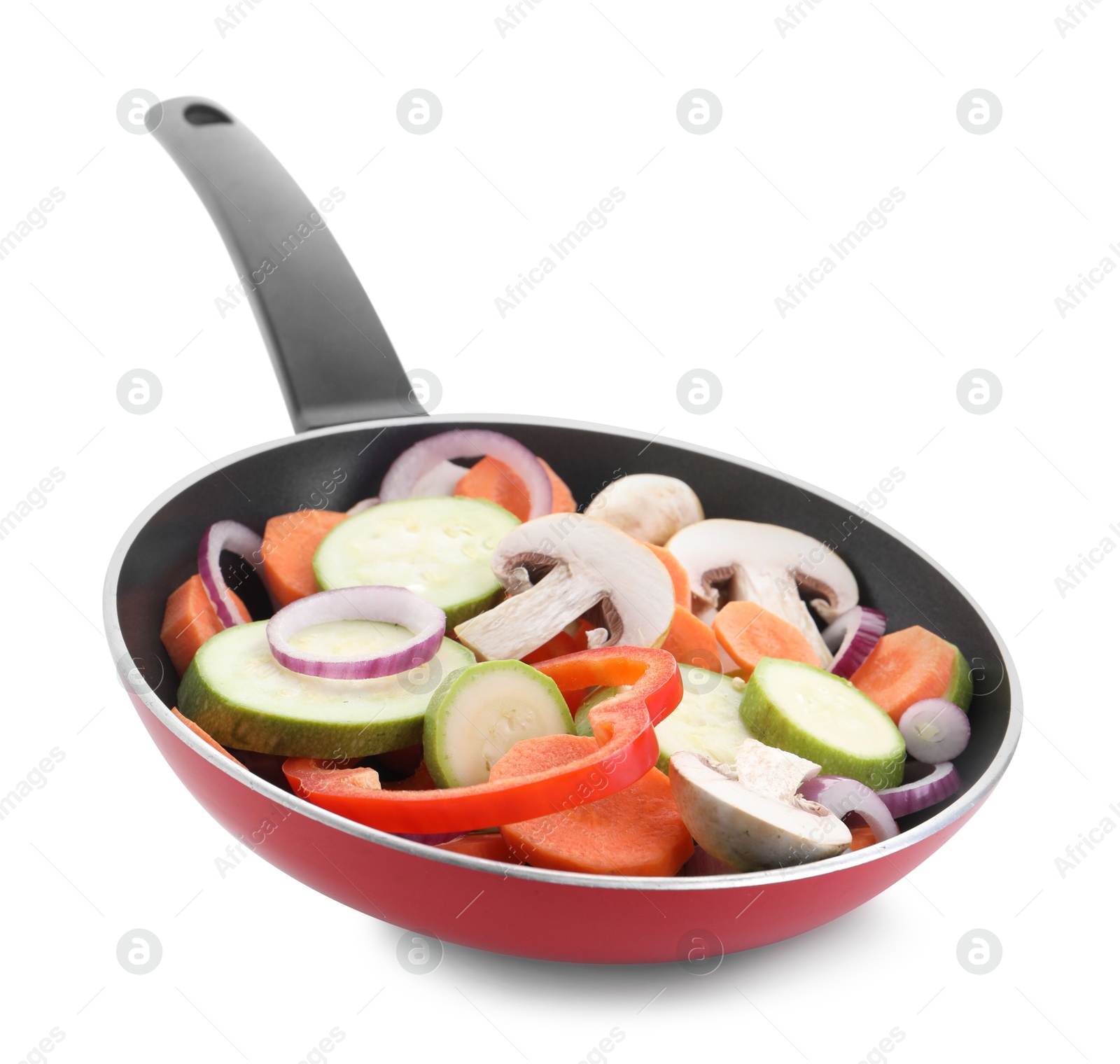 Photo of Frying pan with mix of fresh vegetables and mushrooms isolated on white