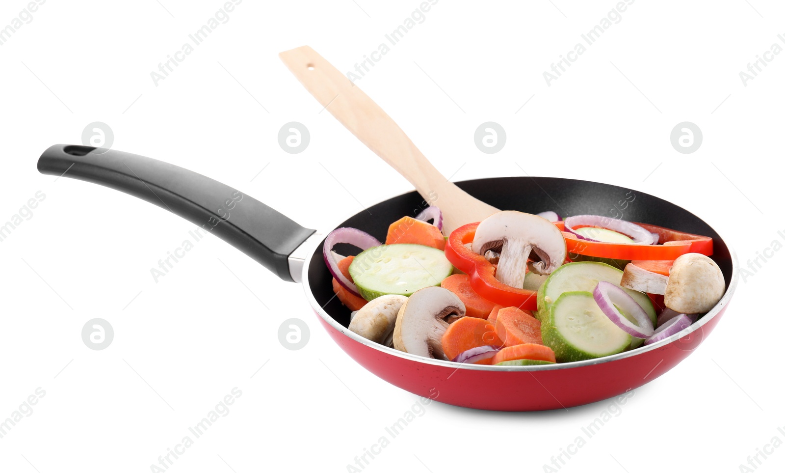 Photo of Frying pan with mix of fresh vegetables, mushrooms and spatula isolated on white