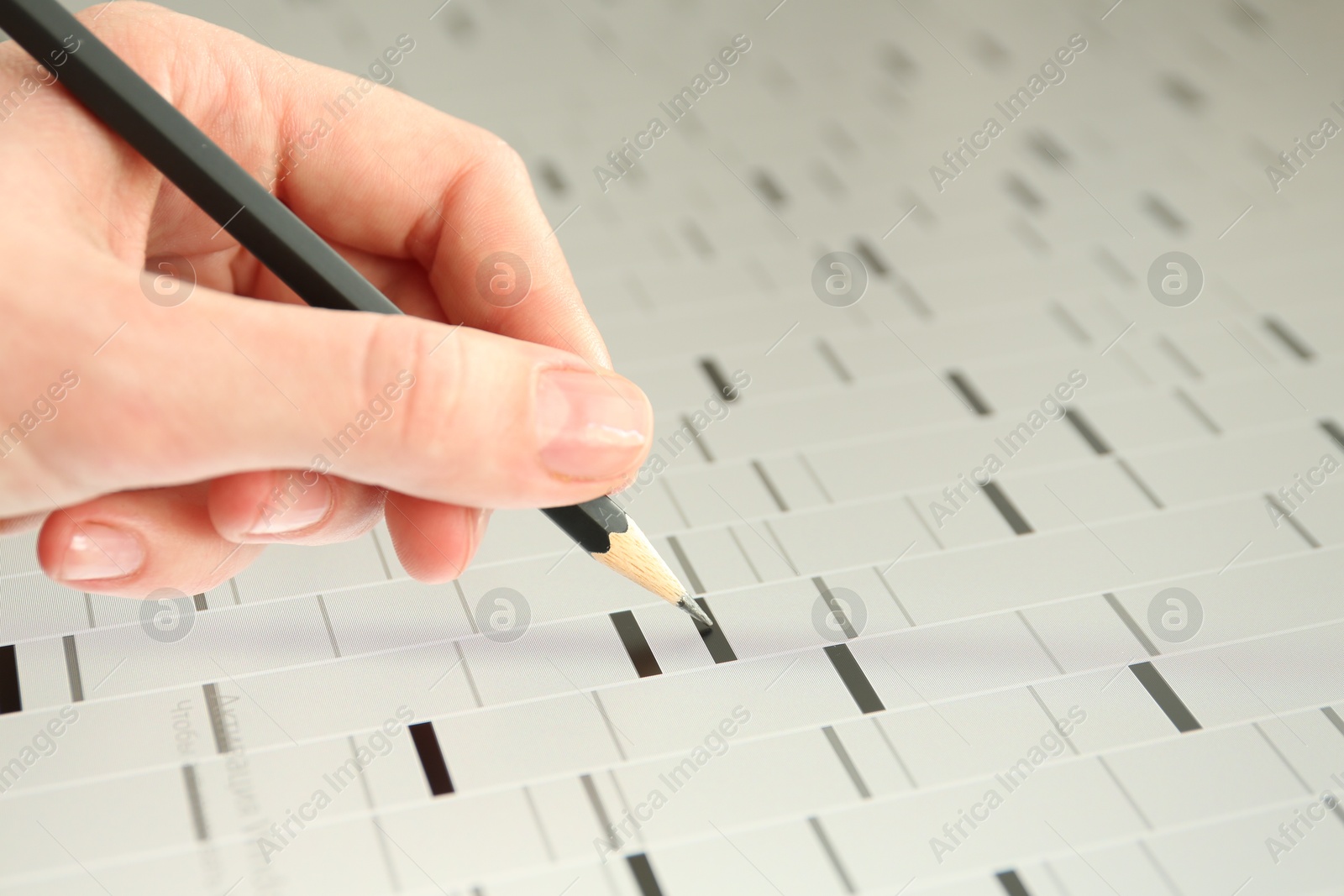 Photo of Scientist analyzing DNA data in laboratory, closeup