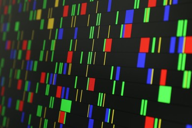 Photo of DNA analysis. Data with genetic information as background, closeup