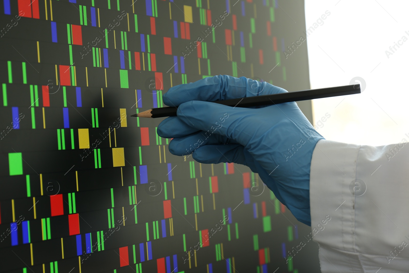 Photo of Scientist analyzing DNA data in laboratory, closeup