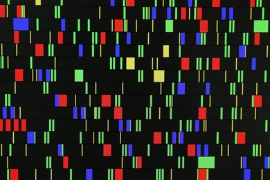 Photo of DNA analysis. Data with genetic information as background, closeup