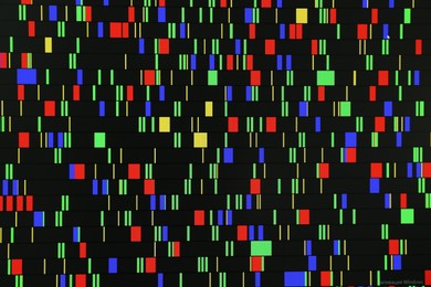 Photo of DNA analysis. Data with genetic information as background, closeup