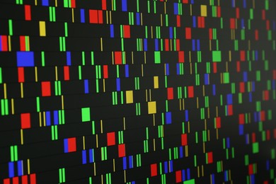 Photo of DNA analysis. Data with genetic information as background, closeup