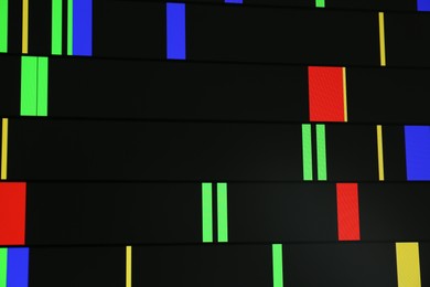 Photo of DNA analysis. Data with genetic information as background, closeup